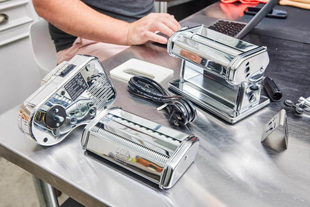 Marcato Atlas Motor attached to classic Italian pasta machine making spaghetti strands