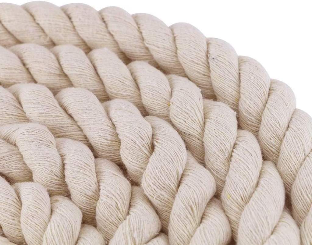 coiled Faxco 10ft natural cotton rope on wooden table, showcasing triple-strand texture and earthy beige color for a rustic unboxing vibe