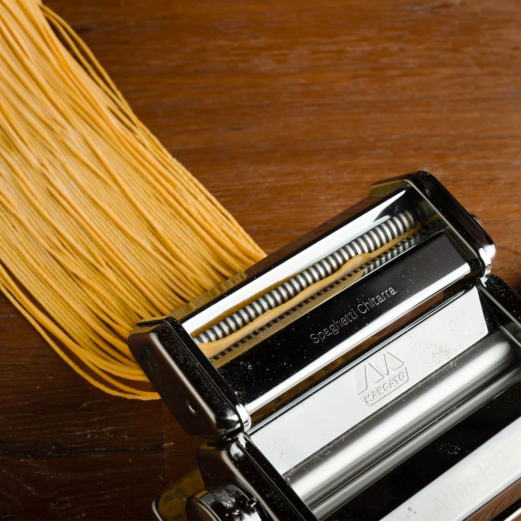Close-up of ravioli being cut using Marcato attachment on Atlas 150.