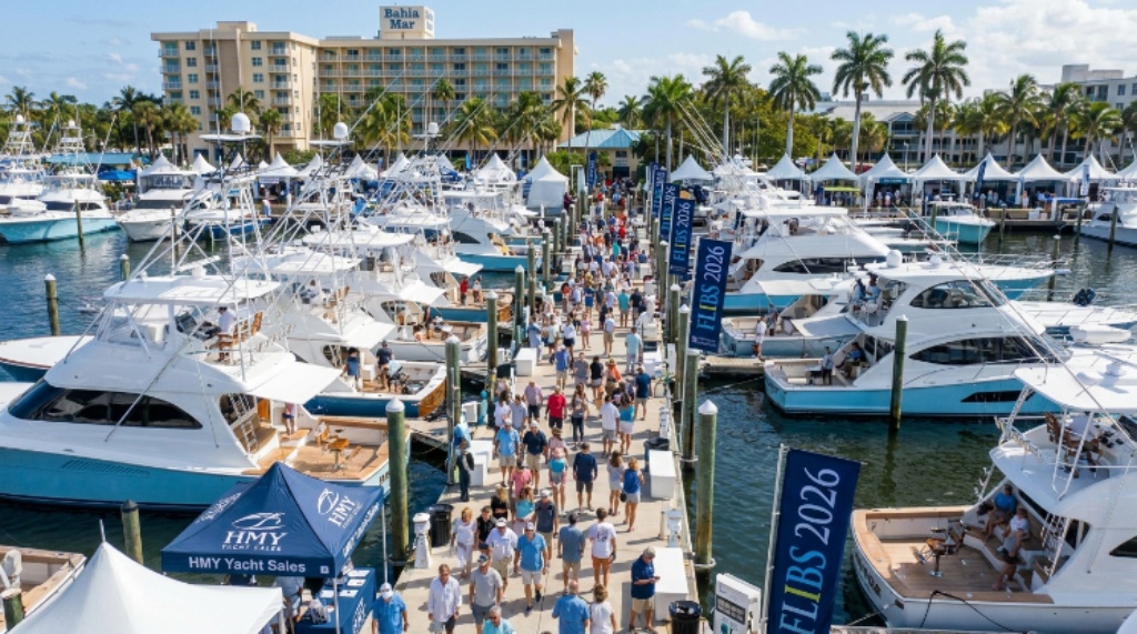 Visitors exploring sport fishing boats and yacht brokerage displays at Bahia Mar Yachting Center during FLIBS 2026 in Fort Lauderdale, Florida