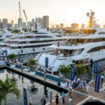 A row of luxury superyachts docked along the floating pontoons at Superyacht Village during the Fort Lauderdale International Boat Show 2026