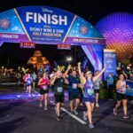 Runners crossing the finish line at the Disney Wine and Dine Half Marathon 2026 inside EPCOT at Walt Disney World Resort in Orlando, Florida