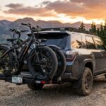 Hitch carrier holding two fat tire bikes on an SUV.
